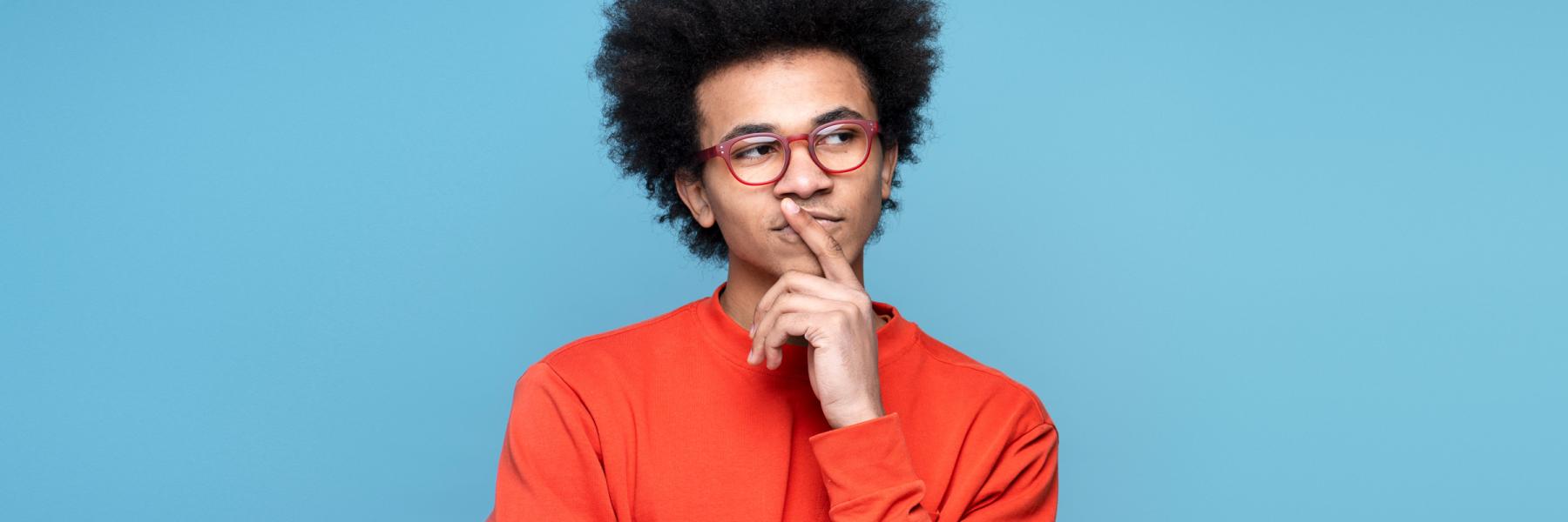 young black man looking thoughtful, contemplating his options